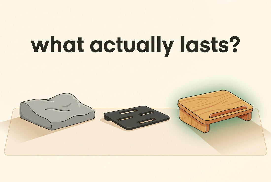 Illustrated cover: three under-desk footrests side by side, a solid honey-bamboo one, a soft grey foam one slightly squashed, and a thin black plastic one, in warm cream tones